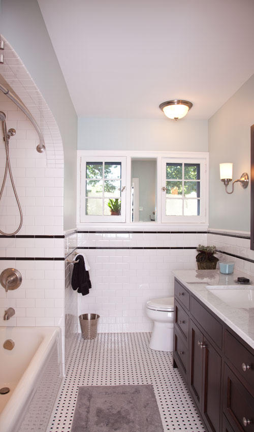 <p>Built in 1930, this classic Tudor home looks fresh and clean after its recent renovation. The guest bathroom includes a custom vanity with a carrera marble top, subway tile, and a heated floor.</p>
