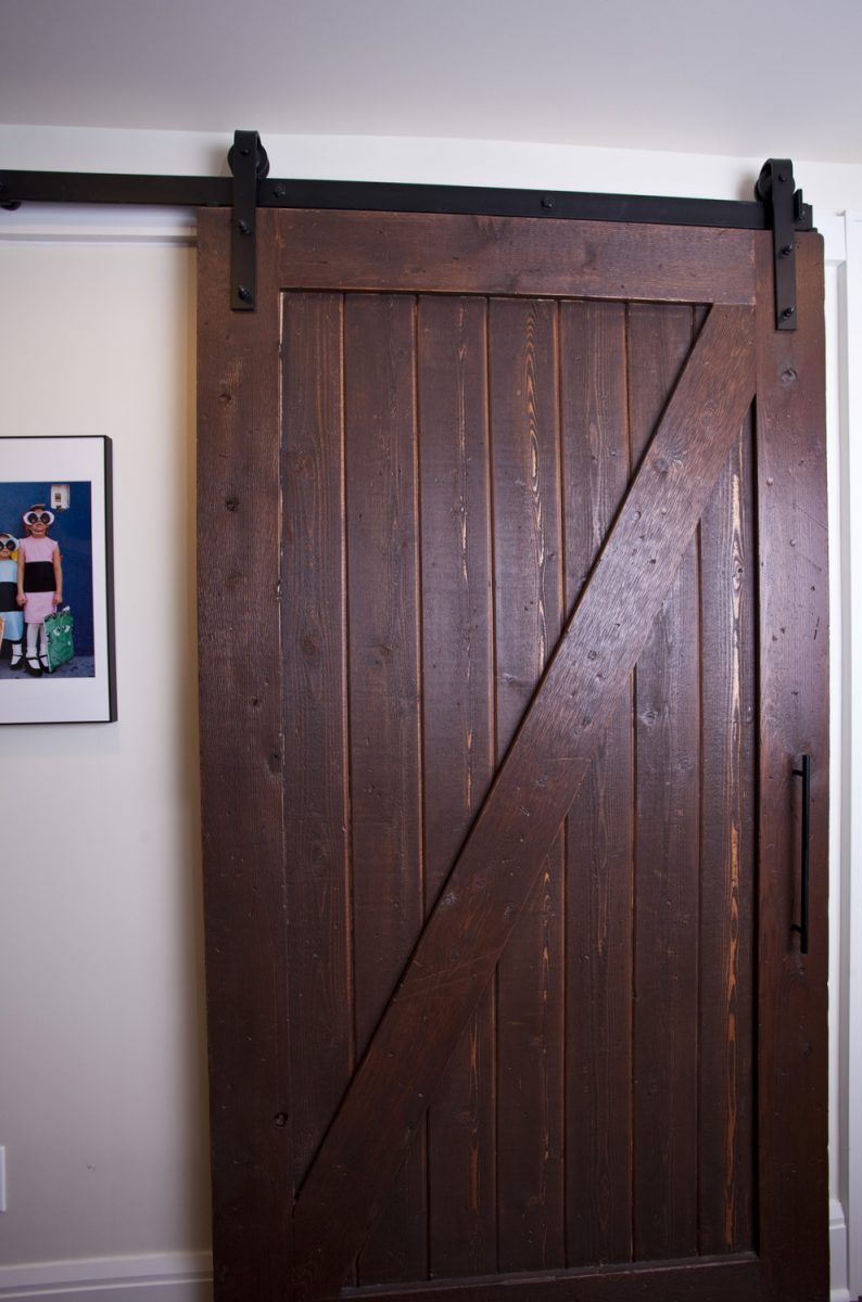 <p>A custom barn door built in the TreHus shop.  It slides open to reveal a built-in desk.</p>
