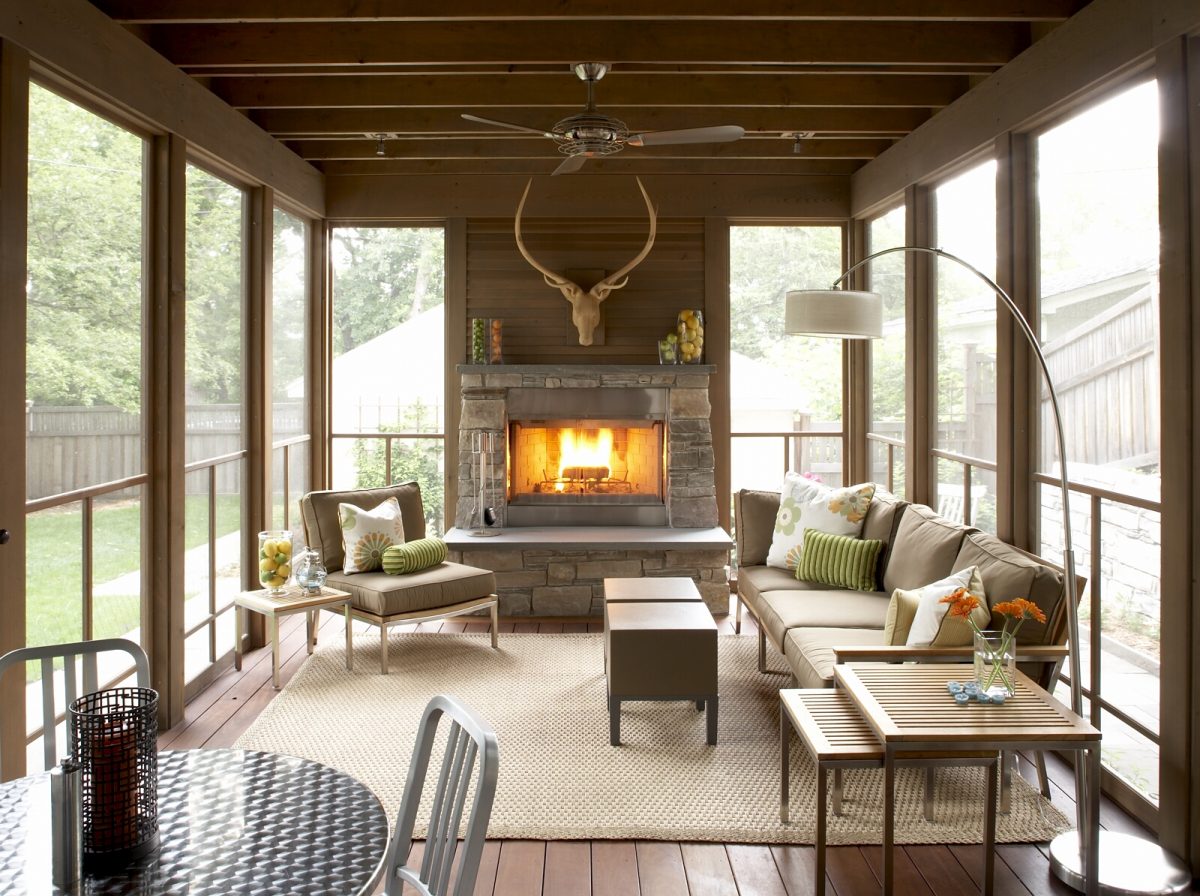 <p>This handsomely crafted porch extends the living area of the home’s den by 250 square feet and includes a wood burning fireplace faced with stone. The Chilton stone on the fireplace matches the stone of an existing retaining wall on the site. The exposed beams, posts and 2” bevel siding are clear cedar and lightly stained to highlight the natural grain of the wood. The existing bluestone patio pavers were taken up, stored on site during construction and reconfigured for paths from the house around the porch and to the garage. Featured in Better Homes &amp; Gardens and the Southwest Journal.</p>
