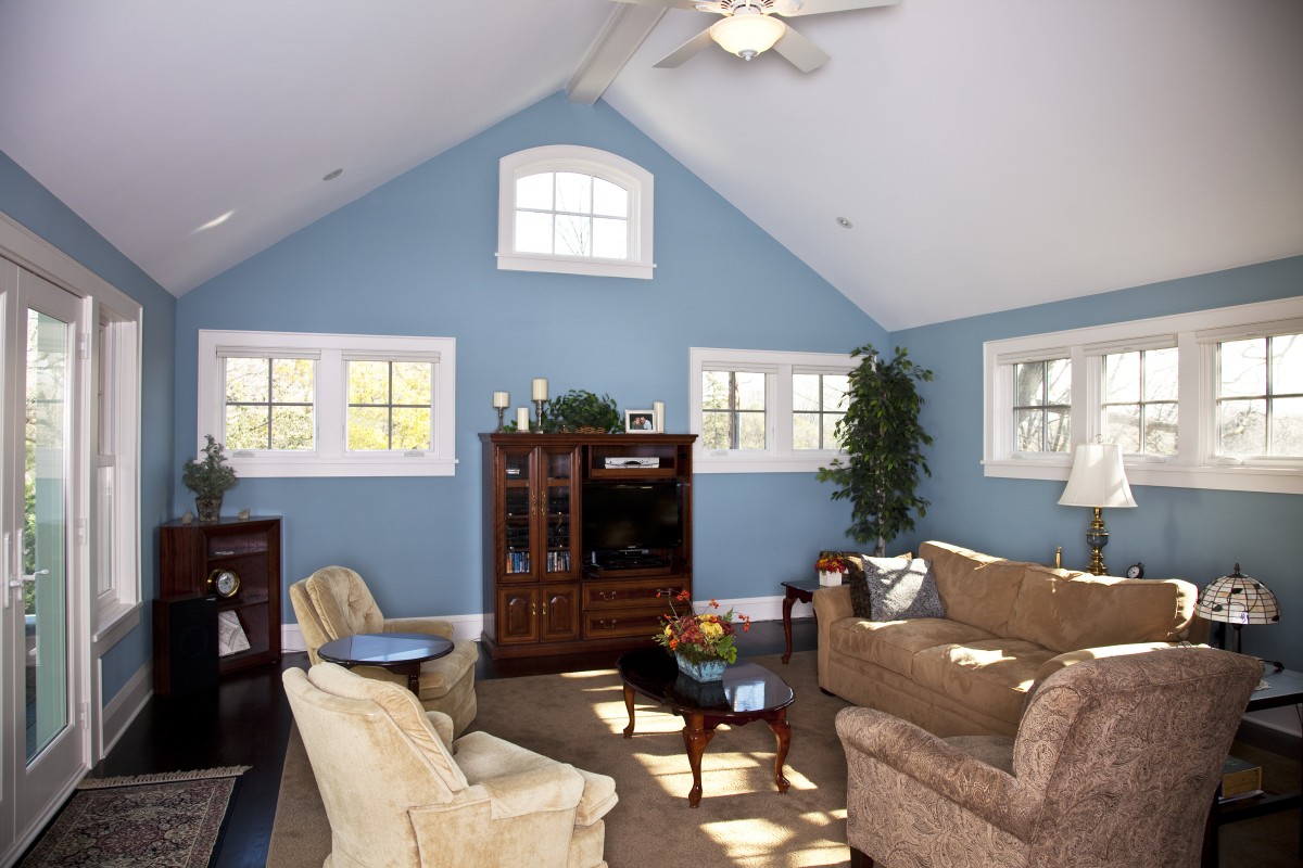 <p>A shot of the family room at the back of the home.  The vaulted ceiling and many windows make this space feel large and light.</p>
