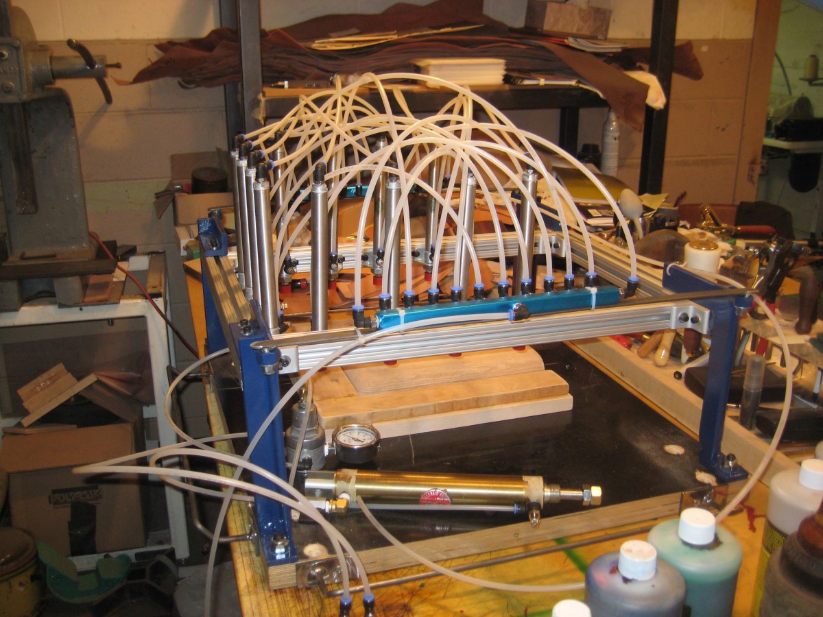 <p>This is a leather-press in ISKO’s shop that they made to press the bag.  According to them, there are approximately 150 places it could leak air (but it doesn’t, or there would be no bag).</p>
