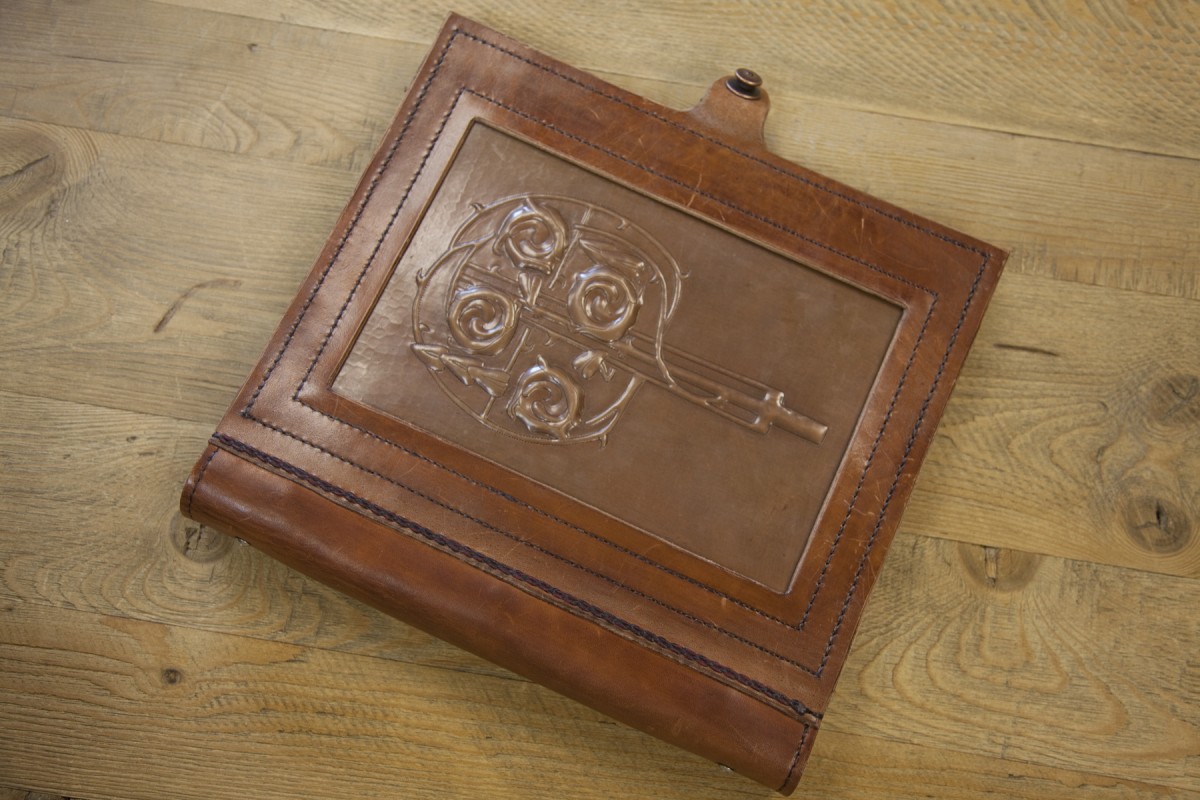 <p>ISKO made this beautiful presentation book by hand-stitching a piece of copper we had into a leather binder they had created.</p>
