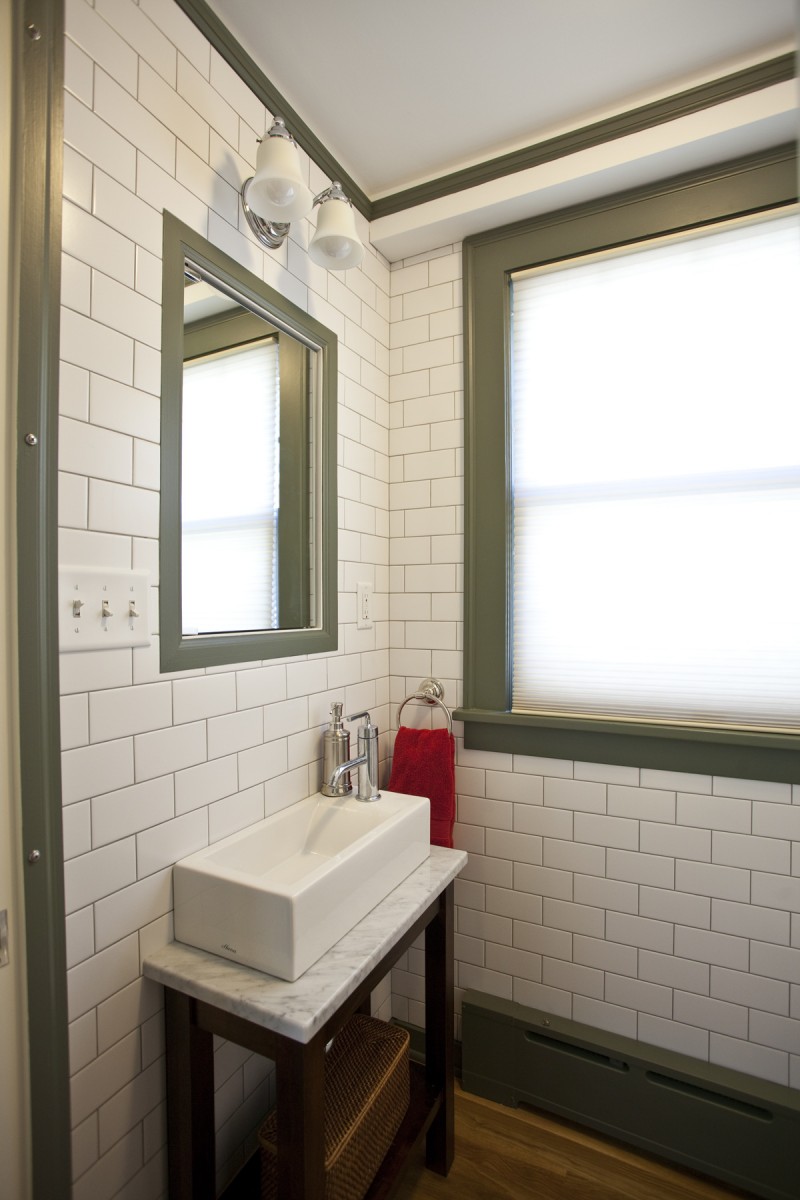 <p>Winner of 2014 Chrysalis Regional &amp; National Awards – Interiors &gt; $100,000.</p>
<p>This<span style="color: #3d3e39;"> powder room was remodeled with floor-to-ceiling subway tile, and features a custom built vanity with a carrera marble top and a small, modern, console sink.</span></p>
