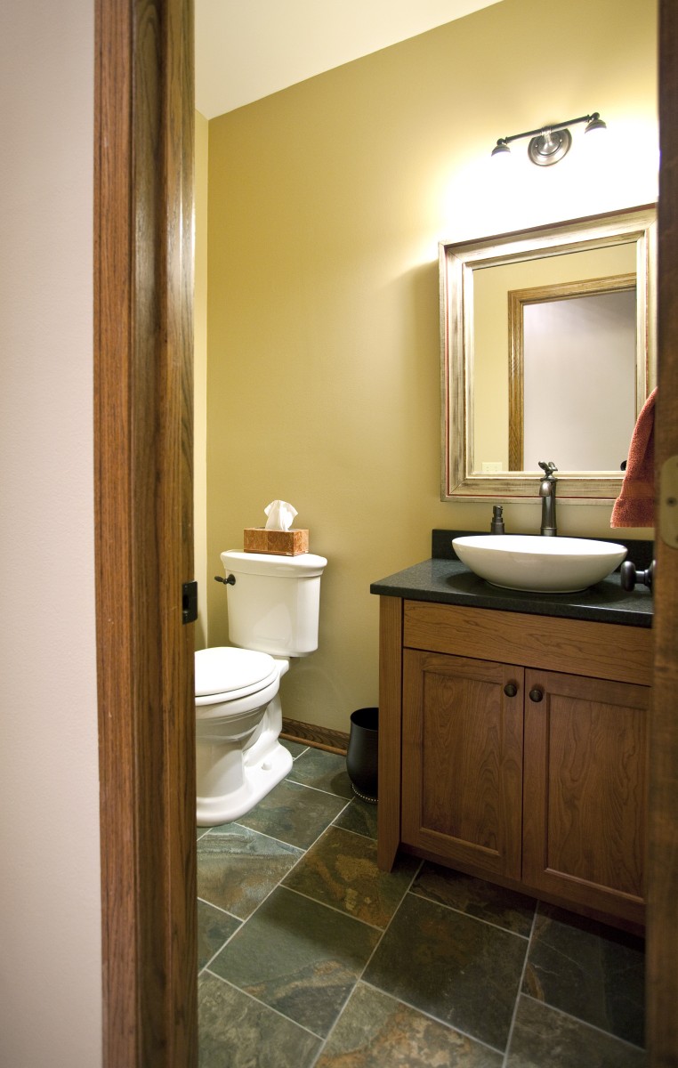 <p>This powder room was remodeled in conjunction with the kitchen remodel, with a custom cherry vanity and new slate floor.</p>
