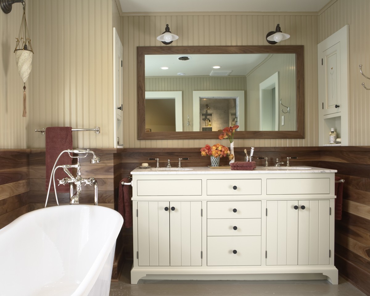 <p>Walnut wainscoting, beadboard, and carrera marble combine to make this a beautiful and unique bathroom. Every effort was made to create a feel of historic authenticity.</p>
