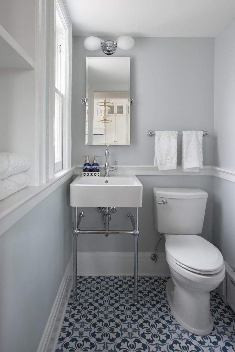 <p>The Powder room was particularly small and housed a large radiator that carried much of the heating load for that end of the house.  Improving the size of the powder was solved by recessing the radiator into a wall and finding more appropriately sized fixtures for the petite space.</p>
